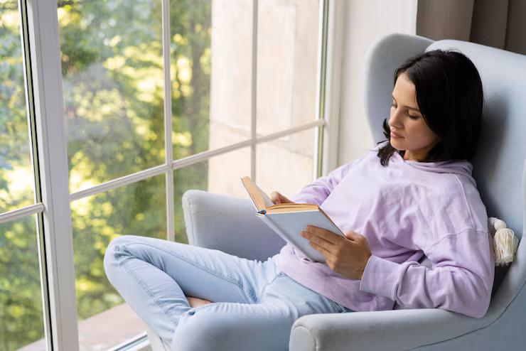 young-woman-reading-from-book-home-view-point-install